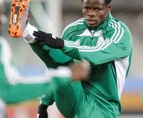 Nigeria's Taye Taiwo stretches during a soccer practice in Bloemfontein, South Africa, Wednesday, June 16, 2010. The Nigerians are preparing for their World Cup group B soccer match against Greece on Thursday. (AP Photo/Rick Bowmer)